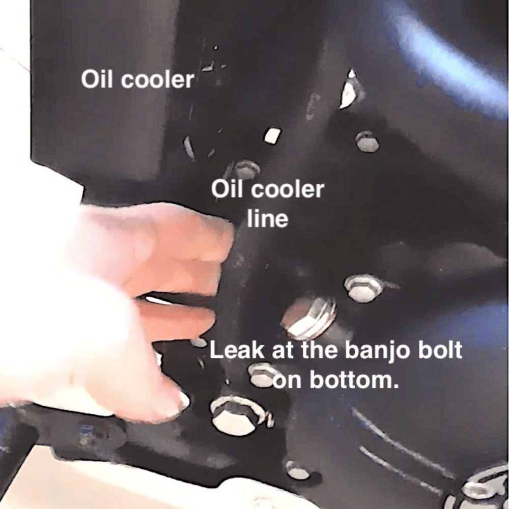 Picture of Oil cooler, cooler line and the leak I found at the bottom.